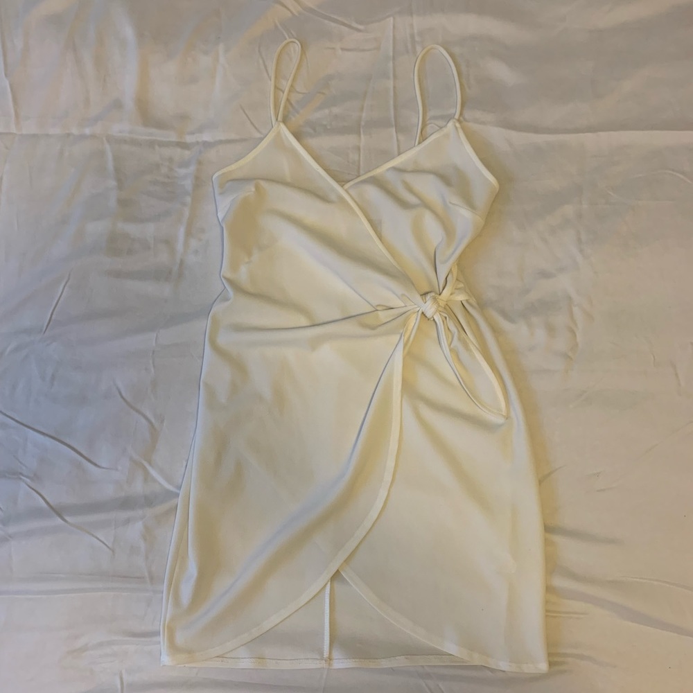 Wrap mini dress with tie at waist. From Pitaya Boutique